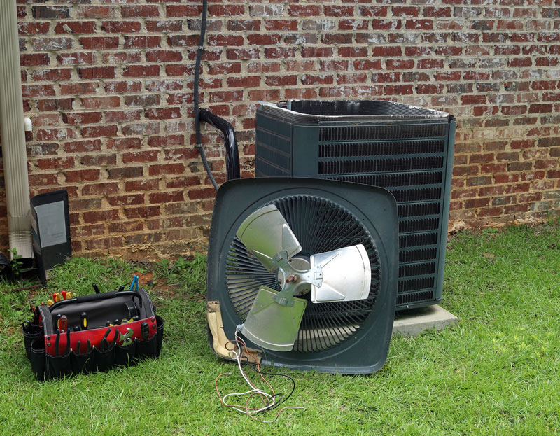 AC-Installation Air Conditioner Condenser coil with tools being repaired